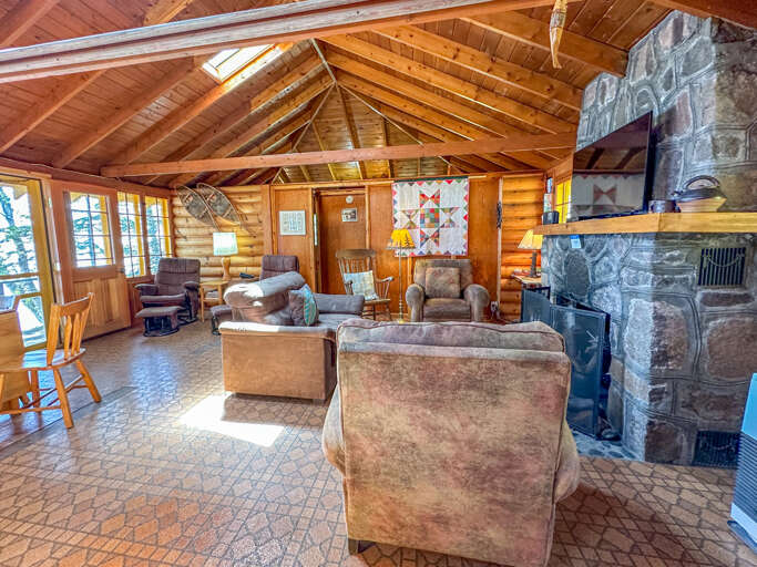 The raised, open ceiling of this cabin and it's cabin-style interior means there are no walls that go all the way up to the ceiling, so each bedroom is semi-private.