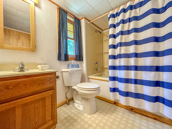 Bathroom 1 is located near Bedroom 1