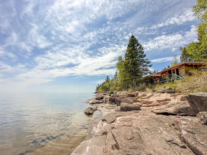 The home features a private Lake Superior shoreline area.