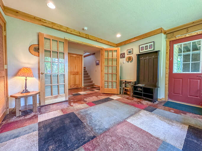 This bedroom is very light and bright and has a door leading to the lower level patio space.