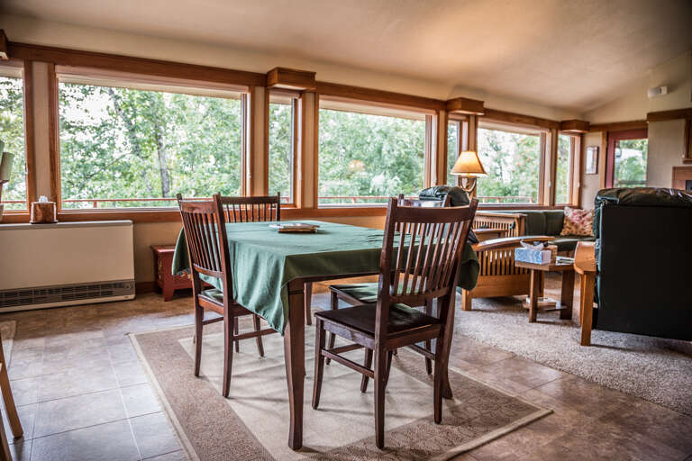 The dining room table seats 4 guests.
