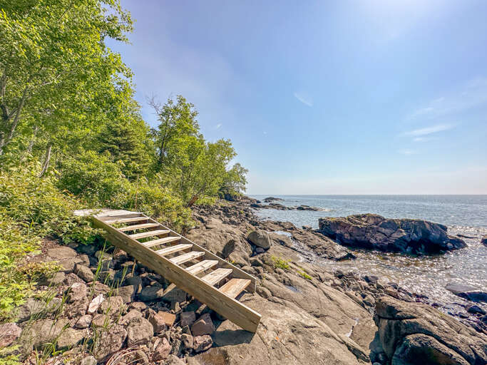 Take the stairs down to your private shoreline area.