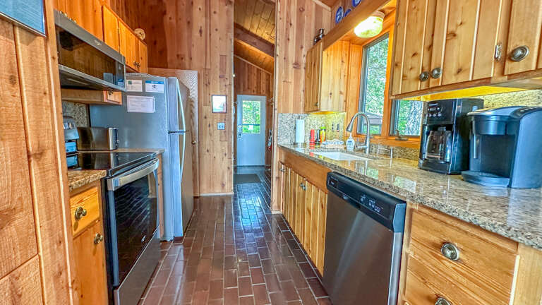 Other side of the kitchen looking towards the entryway. Other side of the kitchen looking towards the entryway.