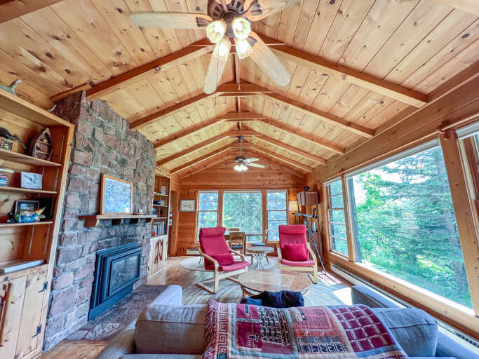 The great stone wood-burning fireplace is the focal point of the living room.