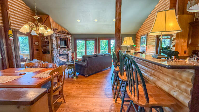 Dining area, living room, and kitchen.