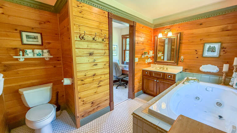 Toilet and vanity in Bathroom 1.