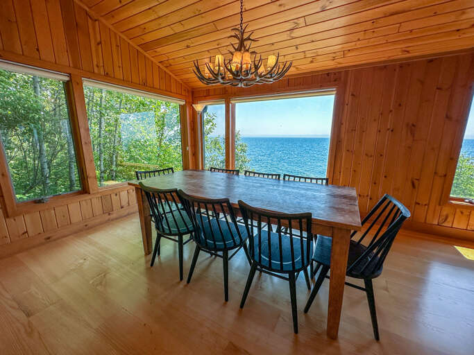 Enjoy a meal at the dining room table with amazing Lake Superior views.