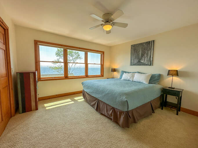 Bedroom 3 is located on the upper level and has views of Lake Superior.