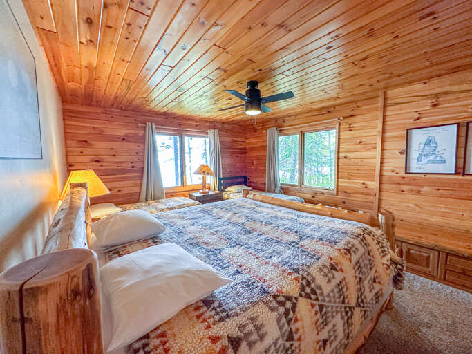 Bedroom 2 is located on the lower level and has a king bed and two twin beds.