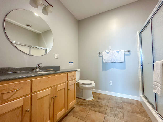 Bathroom 2, located on the lower level, has a shower