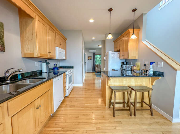 Kitchen looking back towards the entryway Kitchen looking back towards the entryway