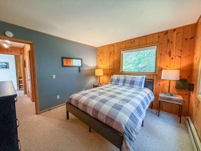 This bedroom has a queen bed