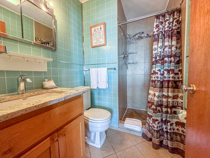Amazing Grace has a cozy bathroom with a walk-in shower. Amazing Grace has a cozy bathroom with a walk-in shower.