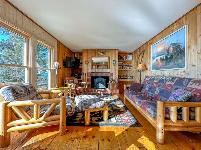 Enjoy a cozy evening in the living room next to the woodstove.