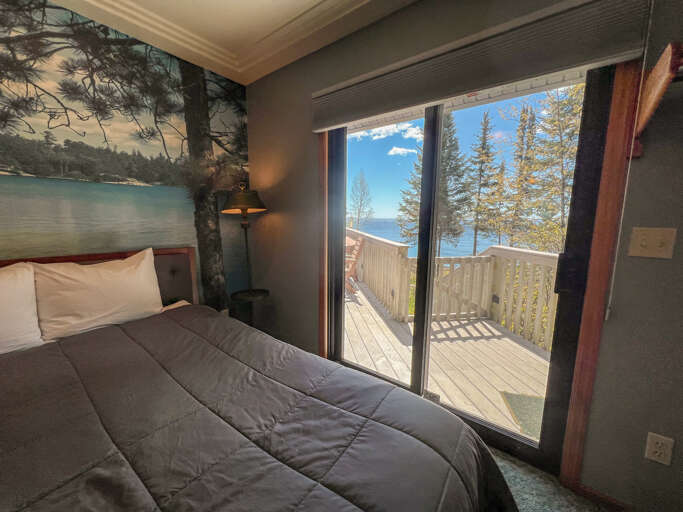 Enjoy Lake Superior views from bed or step out onto the lake-facing deck.