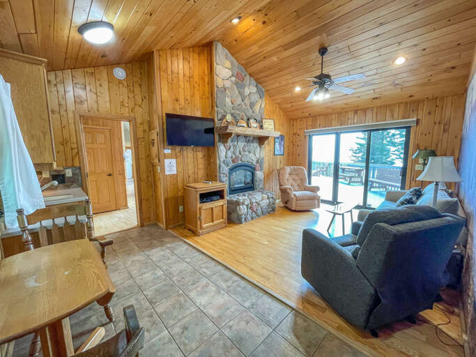 Enjoy a movie on the SmartTV. This room also features access to the lake-facing deck.