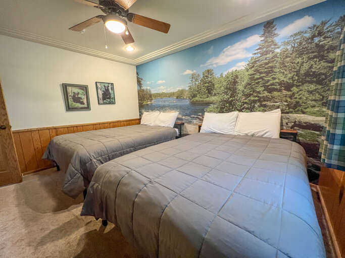 This room features two queen beds.