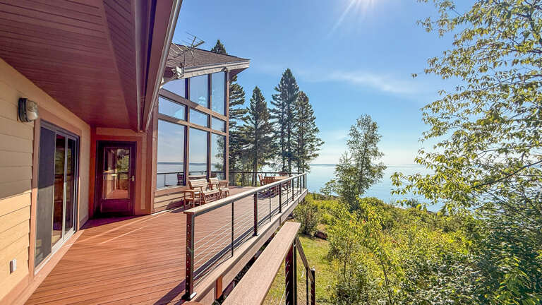This expansive deck offers sweeping lake views framed by towering pines and endless blue sky—perfect for morning coffee or soaking up the sunset with loved ones.