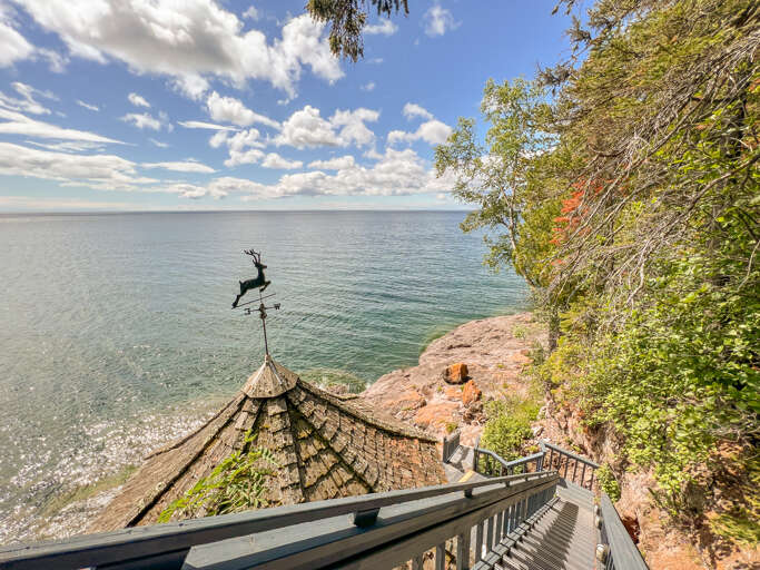 The gazebo is accessed by a staircase going down.