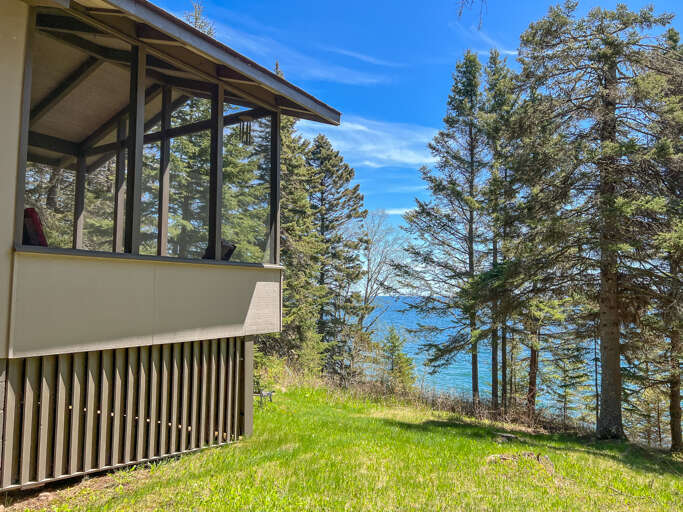 The gentle sloping yard that leads directly to a picturesque ledge rock beach.