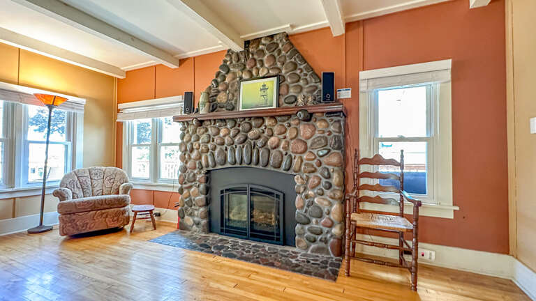 Stone surround fireplace in the living room.