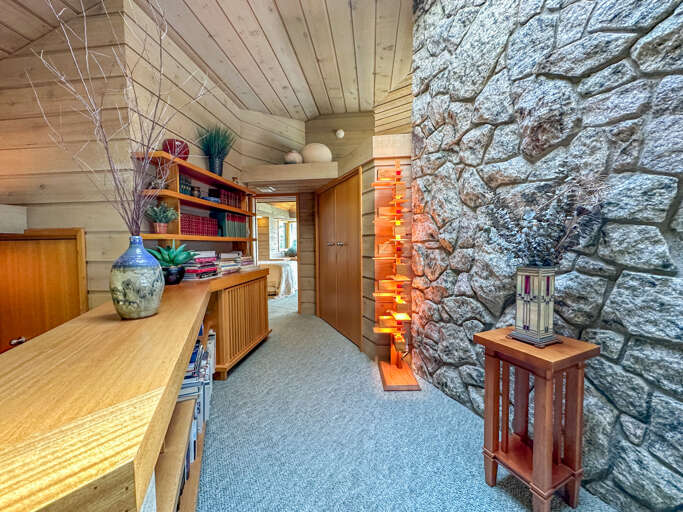 Custom furniture and a broad library of books.