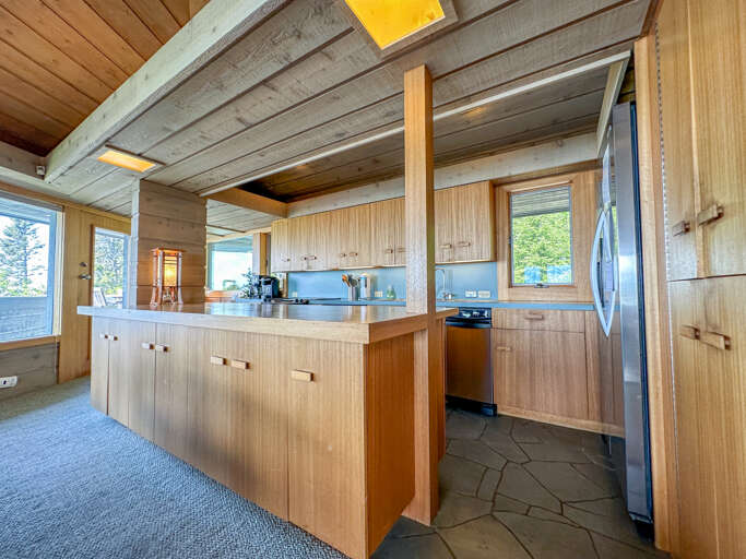 Prepare a home cooked mean in the home's kitchen.