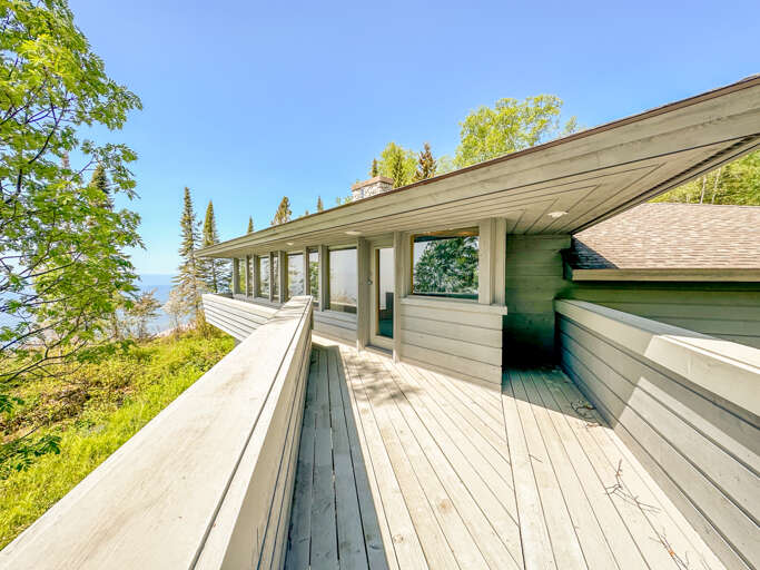 This deck is located just off of Bedroom 1 on the main level.