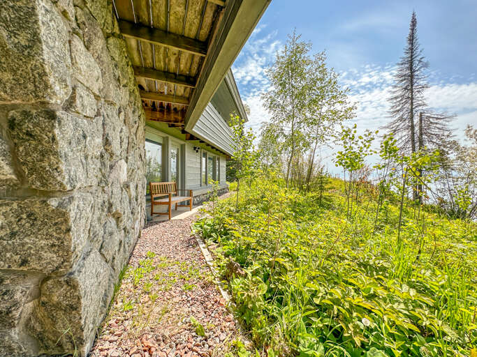 Both bedrooms and the sitting area on the lower level have doors that lead out to the yard.