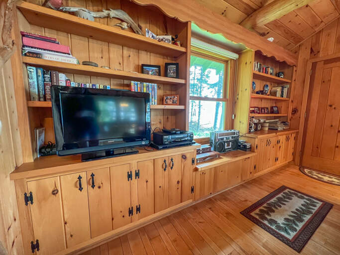 There is a TV and small library of books and movies.