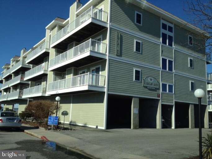 Multi-level Building With Balconies And Ground-floor Parking