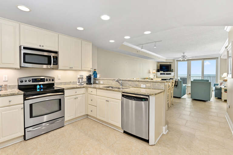 Spacious Kitchen Leading To Luminous Living Area With Ocean View