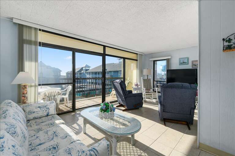 Bright Balcony, Blue Chairs, Big Windows, Beach View