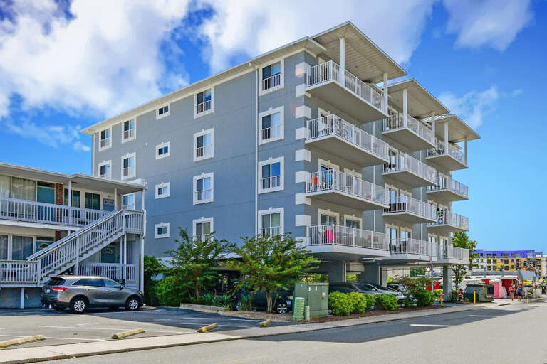 Gray Building, Balconies, Blue Sky Background
