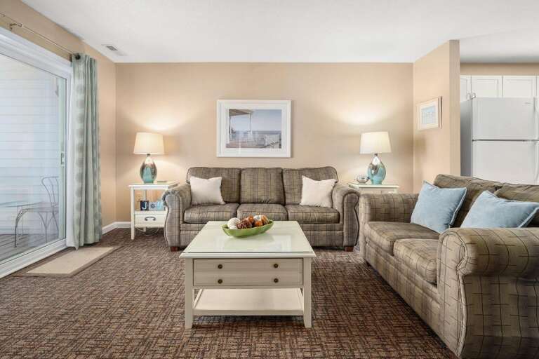 Living Room In Vacation Rental With Sofa, Chairs, Coffee Table