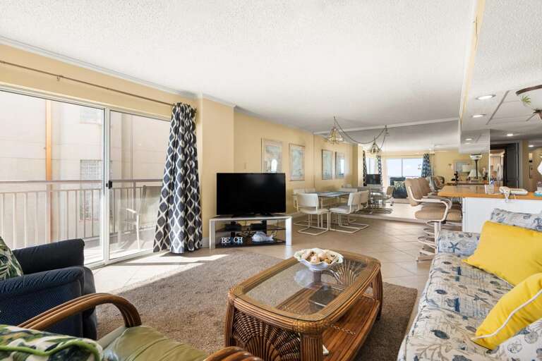 Bright Beachside Vacation Rental Interior With Balcony View