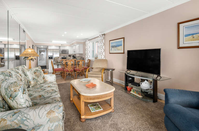 Spacious Living Room Leading To Dining Area In A Vacation Rental