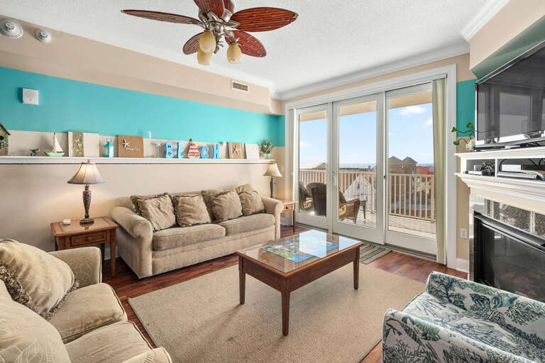 Seaside Living Room With Sliding Doors To Balcony