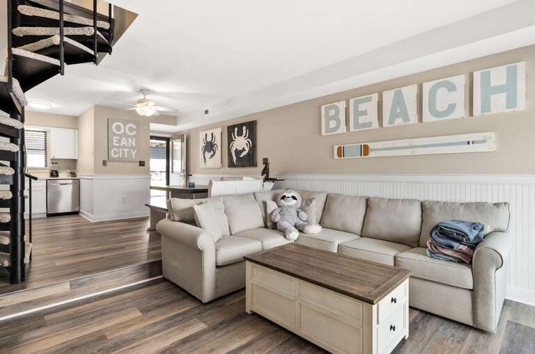 Beach-themed Living Space With Light Sofa, Wooden Floors