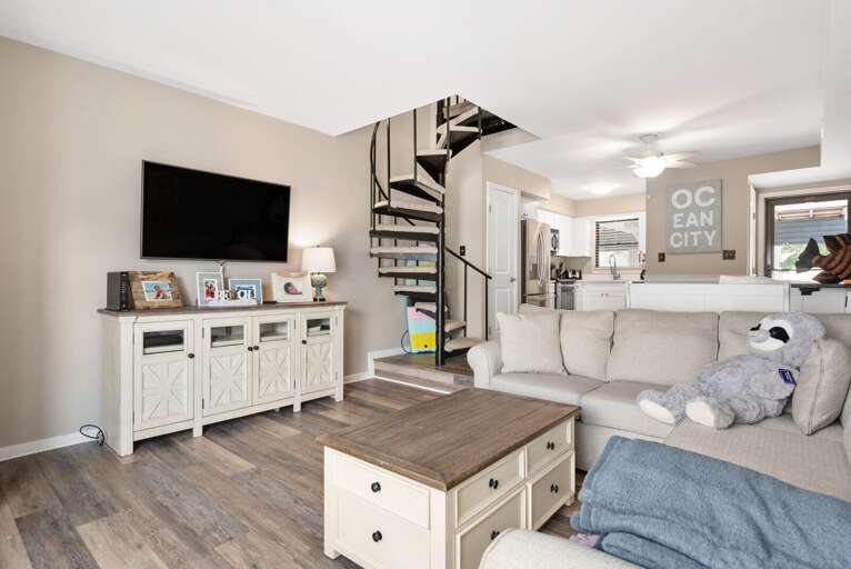 Spacious Living Space With Sleek Shelves And Sizable Screen