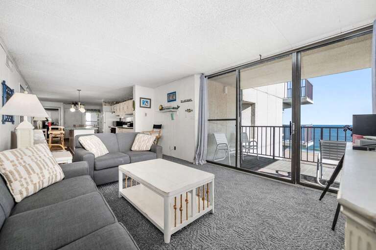 Seaside Vacation Rental Living Space With A Balcony Overlooking The Ocean