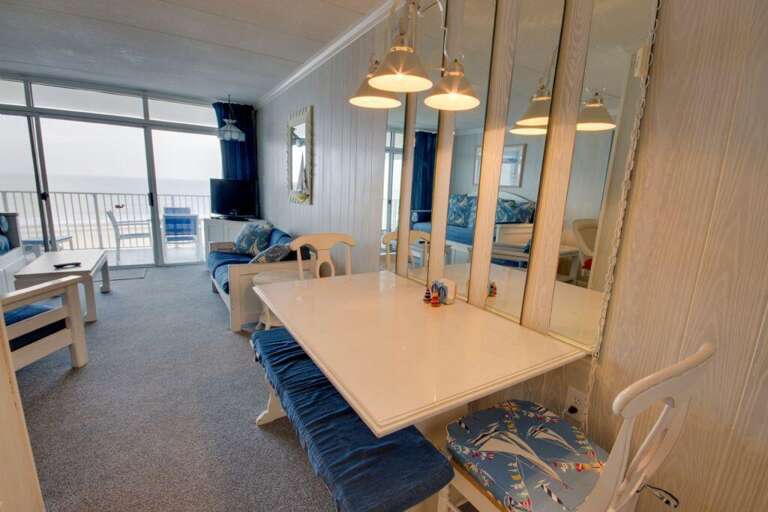 Sea View Suite Showing A Dining Table, Chairs, And Balcony Overlooking The Ocean