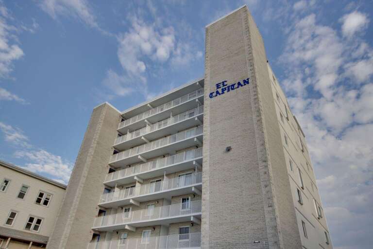 Skyward Structure Standing, Clouds Clustered Behind