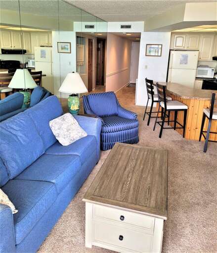 Blue Sofas Balance Beige Backgrounds In A Spacious Living Layout