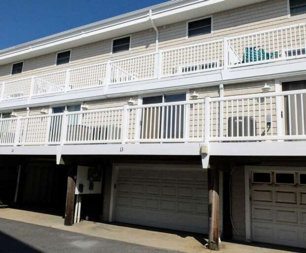 Balconied Building, Bright Banisters, Beneath Blue Sky