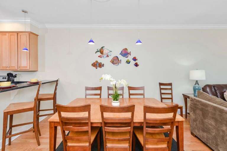 Wooden Table With Chairs In Spacious Dining Area, Decorated Wall, Kitchen Background