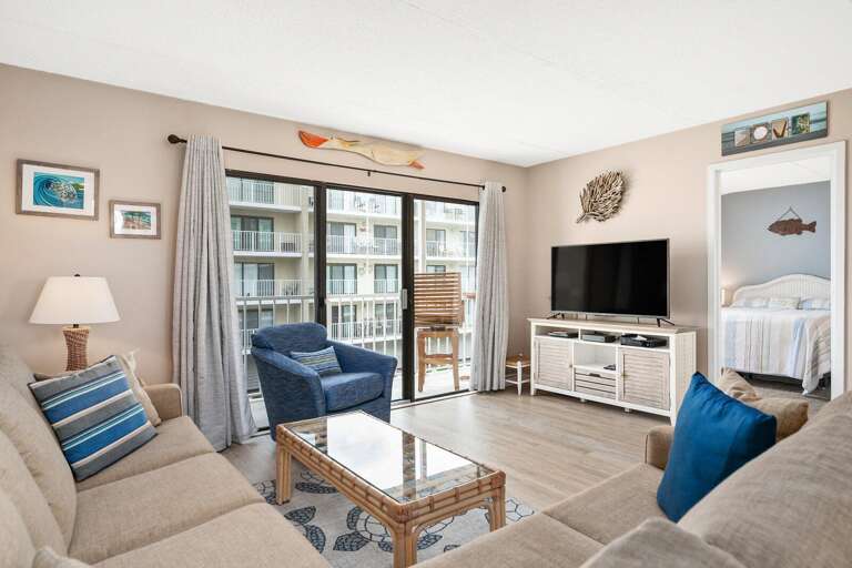 Neutral-toned Living Space Leading To Balcony, Blue Accents, Beach Decor
