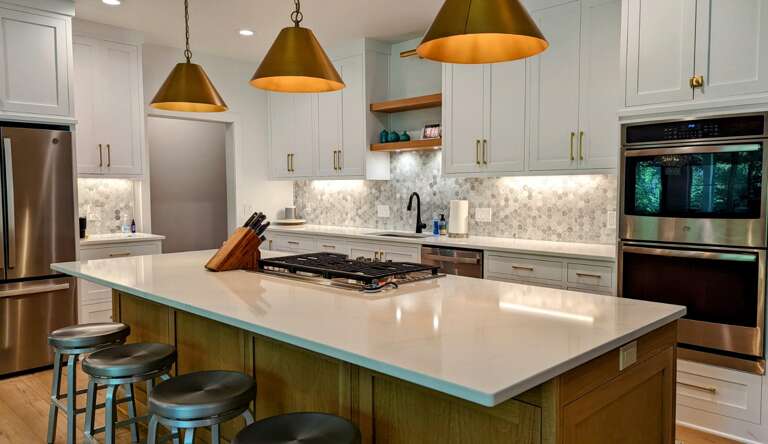 Residential Kitchen Interior With Island And Bar Stools