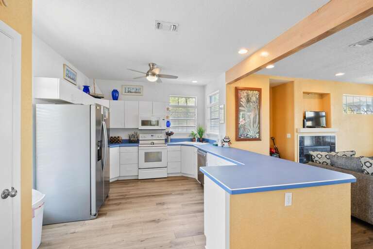 Interior Of A Kitchen With White Cabinets And Blue Countertops