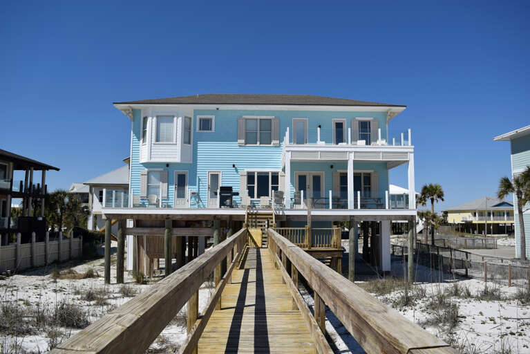Gulf side of the home with private dune walkover and great deck space.